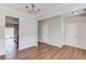 Neutral dining room with wood floors next to a hall and a glimpse of the kitchen at 1554 Park Grove Dr, Lawrenceville, GA 30046