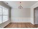 Dining room with wood floors, decorative wall trim and a chandelier at 1554 Park Grove Dr, Lawrenceville, GA 30046