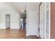 Bright entryway featuring wood floors and neutral wall colors leading to other rooms at 1554 Park Grove Dr, Lawrenceville, GA 30046