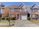 Charming two-story brick home with well-manicured lawn and attached one-car garage at 1554 Park Grove Dr, Lawrenceville, GA 30046