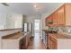 Modern kitchen featuring stainless steel appliances, wood cabinetry and tile backsplash at 1554 Park Grove Dr, Lawrenceville, GA 30046