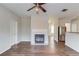 Living room with fireplace and wood floors; stainless steel appliances in the background at 1554 Park Grove Dr, Lawrenceville, GA 30046