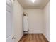 A small, simple utility room with a water heater on a platform at 1554 Park Grove Dr, Lawrenceville, GA 30046