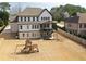 Expansive backyard features a playset, covered patio, and well-maintained lawn, perfect for outdoor enjoyment at 1952 Azalea Dr, Lawrenceville, GA 30043
