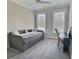 Cozy bedroom with a daybed, soft carpet, and two bright windows at 1952 Azalea Dr, Lawrenceville, GA 30043