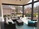 Inviting covered deck featuring comfortable seating and outdoor living space with wooded view at 1952 Azalea Dr, Lawrenceville, GA 30043
