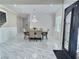 Elegant dining room featuring marble floors, a chandelier, and sophisticated decor at 1952 Azalea Dr, Lawrenceville, GA 30043