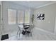 Dining room with modern chandelier, large windows, and marble flooring at 1952 Azalea Dr, Lawrenceville, GA 30043