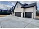 Spacious three-car garage offers ample parking and storage, complementing the home's exterior at 1952 Azalea Dr, Lawrenceville, GA 30043