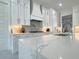 Well-equipped kitchen featuring marble countertops, white cabinets, and stainless steel appliances at 1952 Azalea Dr, Lawrenceville, GA 30043