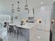 Bright kitchen features a large island, stainless steel appliances, and marble flooring at 1952 Azalea Dr, Lawrenceville, GA 30043