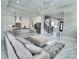 Spacious open-concept living room and kitchen featuring marble floors, tray ceilings, and modern finishes at 1952 Azalea Dr, Lawrenceville, GA 30043