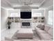 A cozy living room features marble floors, a stone fireplace, built-in shelving, and lots of natural light at 1952 Azalea Dr, Lawrenceville, GA 30043