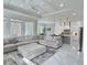 A modern living room showcases a coffered ceiling, marble floors, and connects seamlessly to the kitchen area at 1952 Azalea Dr, Lawrenceville, GA 30043