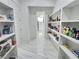 Well-organized pantry with white shelving and ample storage space for food and supplies at 1952 Azalea Dr, Lawrenceville, GA 30043