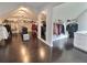 Expansive walk-in closet with wood floors, custom shelving, and full-length mirrors at 1952 Azalea Dr, Lawrenceville, GA 30043
