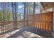 Inviting back deck with wooden railings and privacy screen, offering a serene outdoor space at 2044 Teal Cv, Lithonia, GA 30058