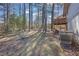 Large backyard with mature trees and a deck, providing a private outdoor retreat at 2044 Teal Cv, Lithonia, GA 30058