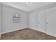 Bedroom with neutral walls, carpet, a window, and a closet for ample storage at 2044 Teal Cv, Lithonia, GA 30058
