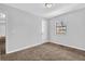 Bedroom featuring neutral walls, carpet, and a window for natural light at 2044 Teal Cv, Lithonia, GA 30058