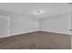 Spacious bedroom with neutral walls, ceiling fan and soft carpeting at 2044 Teal Cv, Lithonia, GA 30058