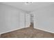 Bedroom with neutral walls and carpet leading into an adjacent room at 2044 Teal Cv, Lithonia, GA 30058