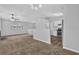 Open-concept living space featuring a view into the kitchen with stainless appliances at 2044 Teal Cv, Lithonia, GA 30058