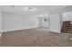 Spacious living room with soft carpet and a staircase to the second floor at 2044 Teal Cv, Lithonia, GA 30058