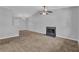 Spacious living room featuring a fireplace, ceiling fan, and neutral walls at 2044 Teal Cv, Lithonia, GA 30058