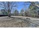 Spacious backyard with mature trees, providing privacy and a natural setting at 2467 Sky Valley Dr, Dacula, GA 30019