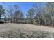 Extensive backyard, partially fenced, providing a private outdoor space with mature trees at 2467 Sky Valley Dr, Dacula, GA 30019