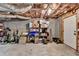 Unfinished basement with a concrete floor and stacked shelves with cleaning supplies at 2467 Sky Valley Dr, Dacula, GA 30019