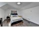 Bright bedroom featuring hardwood floors, a queen-sized bed, and a modern aesthetic at 2467 Sky Valley Dr, Dacula, GA 30019