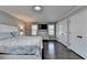 Bedroom featuring hardwood floors, a queen bed, with a dresser and two closets at 2467 Sky Valley Dr, Dacula, GA 30019