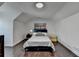Bedroom with hardwood floors and a sloped ceiling at 2467 Sky Valley Dr, Dacula, GA 30019