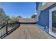 An outdoor deck featuring brown wood, black railings, and a built-in bench at 2467 Sky Valley Dr, Dacula, GA 30019