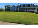 Charming two-story home with a manicured lawn and a welcoming front porch at 2467 Sky Valley Dr, Dacula, GA 30019