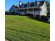 Charming two-story home with a covered front porch and manicured lawn at 2467 Sky Valley Dr, Dacula, GA 30019