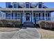 Charming two-story home with a welcoming covered porch and well-maintained landscaping at 2467 Sky Valley Dr, Dacula, GA 30019