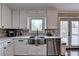 Kitchen with granite counters, stainless steel appliances, and white cabinets at 2467 Sky Valley Dr, Dacula, GA 30019