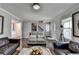 Open-concept living room with neutral tones and natural light at 2467 Sky Valley Dr, Dacula, GA 30019