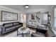 Cozy living room with hardwood floors, leather sofas, and stylish décor at 2467 Sky Valley Dr, Dacula, GA 30019