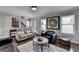 Contemporary living room with modern decor, hardwood floors, and an inviting atmosphere at 2467 Sky Valley Dr, Dacula, GA 30019