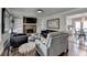 Comfortable living area with a stone fireplace, stylish decor, and an open layout concept at 2467 Sky Valley Dr, Dacula, GA 30019