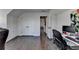 Office area with hardwood floors, built-in storage, and a view of an open doorway at 2467 Sky Valley Dr, Dacula, GA 30019