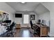 Bright home office featuring hardwood floors, large screen monitors and natural light at 2467 Sky Valley Dr, Dacula, GA 30019