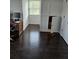 This home office features hardwood floors, bright natural light and built in shelving at 2467 Sky Valley Dr, Dacula, GA 30019