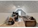 Home office with multiple monitors, a dormer window and sitting area with couch at 2467 Sky Valley Dr, Dacula, GA 30019