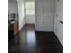 This home office features hardwood floors, bright natural light and built in shelving at 2467 Sky Valley Dr, Dacula, GA 30019