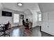 Home office space with hardwood floors, built-in storage, two desks, and bright natural light at 2467 Sky Valley Dr, Dacula, GA 30019